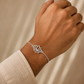 Purple Bird ‘Kamal Kiran’ Silver-Plated Rakhi Bracelet (with Roli Chawal Set)