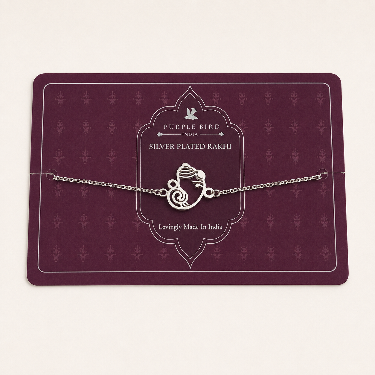 Purple Bird ‘Shubh Ganesh’ Silver-Plated Rakhi Bracelet (with Roli Chawal Set)